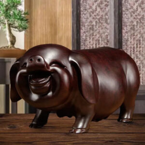 Pear wood carving of the pig, redwood and ebony wood carvings of the pig among the twelve Chinese zodiac animals for attracting wealth. They are tabletop birthday gifts, the lucky golden pig ornaments.